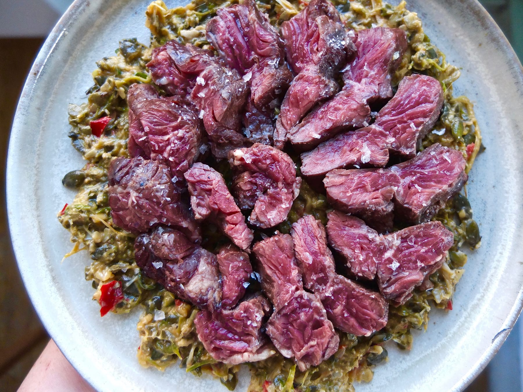 Grilled Onglet with charred spring onion and pumpkin seed salsa