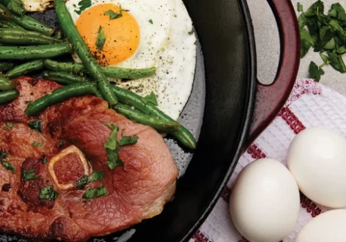 meat and eggs on top of a table