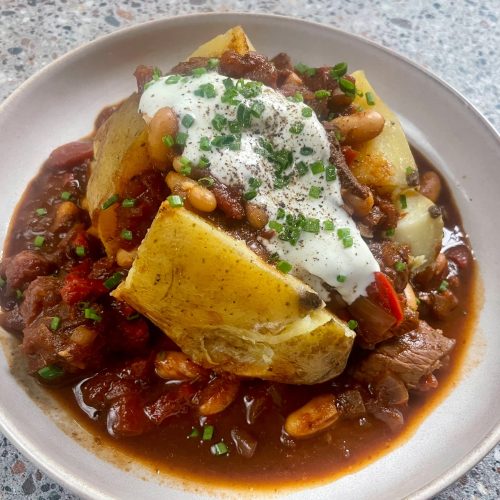 Baked Potatoes with Chilli con Carne plating