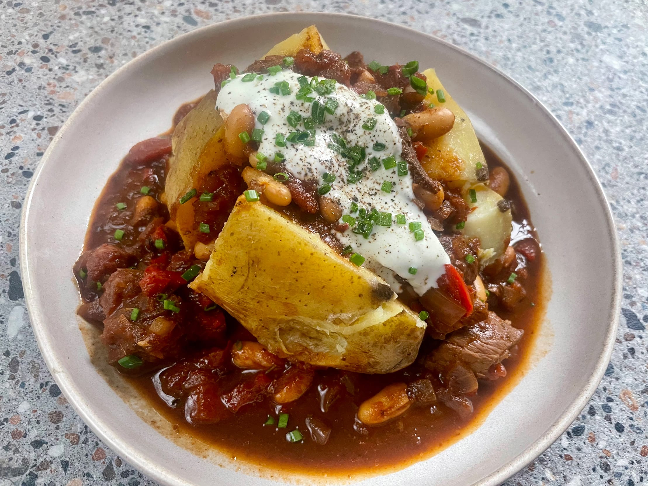 Baked Potatoes with Chilli con Carne plating